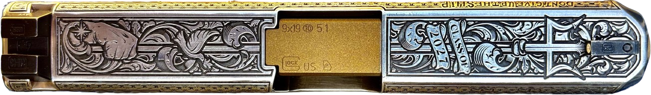 Top view of the engraved USNA Class of 2027 slide showing the trident, “Class of 2027” banner, dove, and fist with compass star honoring the Naval Academy