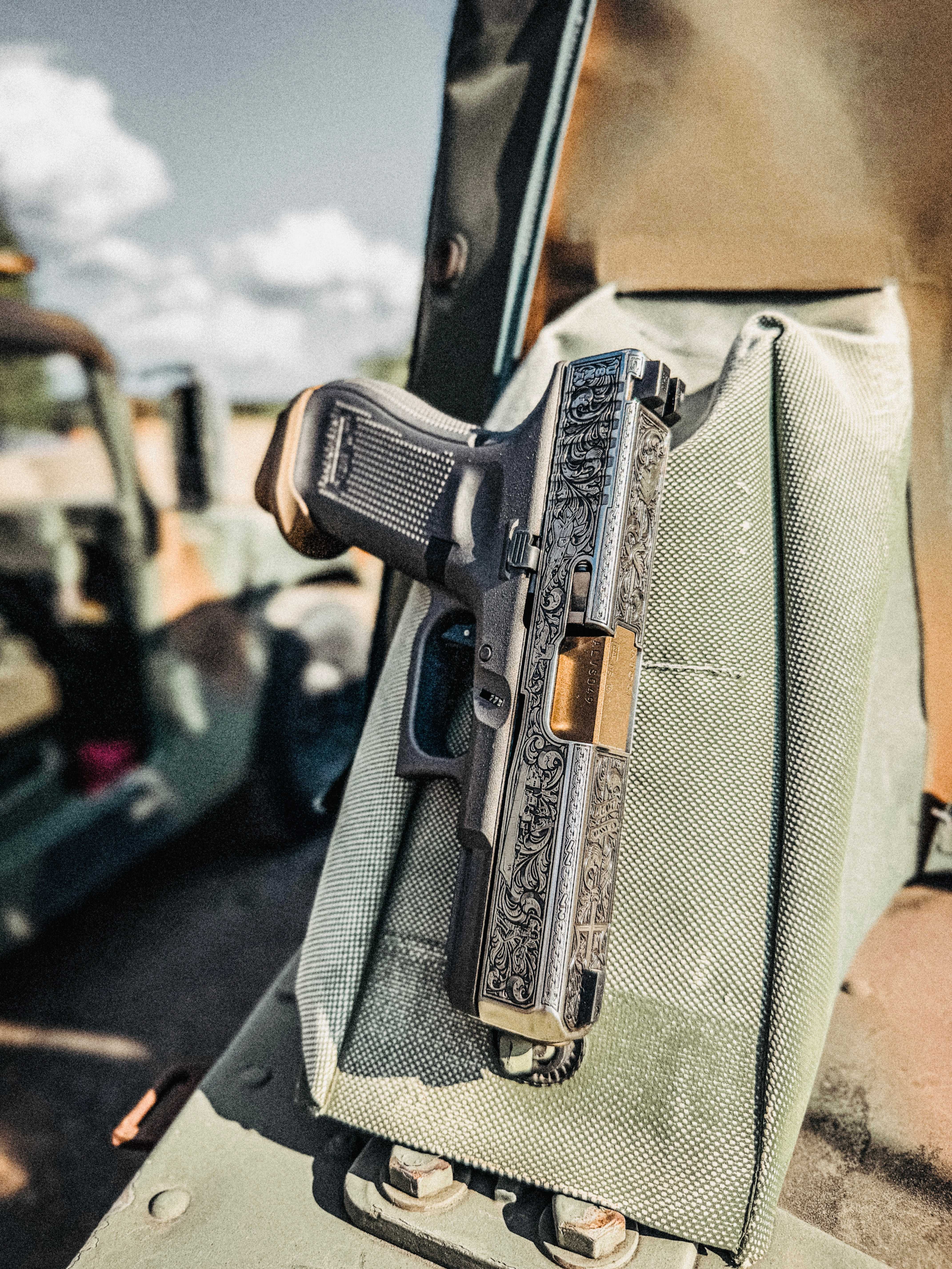 USNA Class of 2027 GLOCK 19X V — engraved slide detail in vehicle interior
