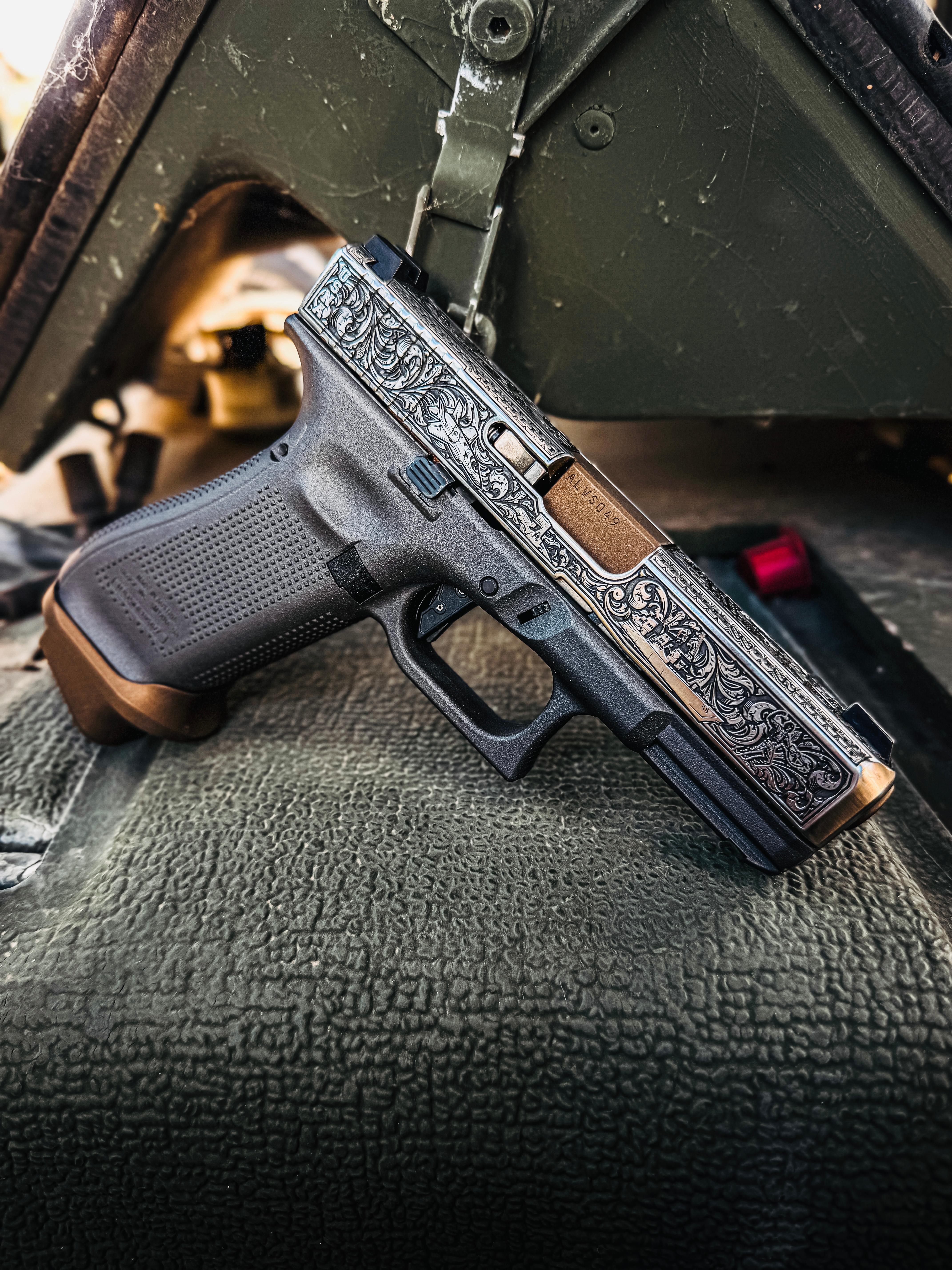 USNA Class of 2027 GLOCK 19X V — resting on vehicle equipment