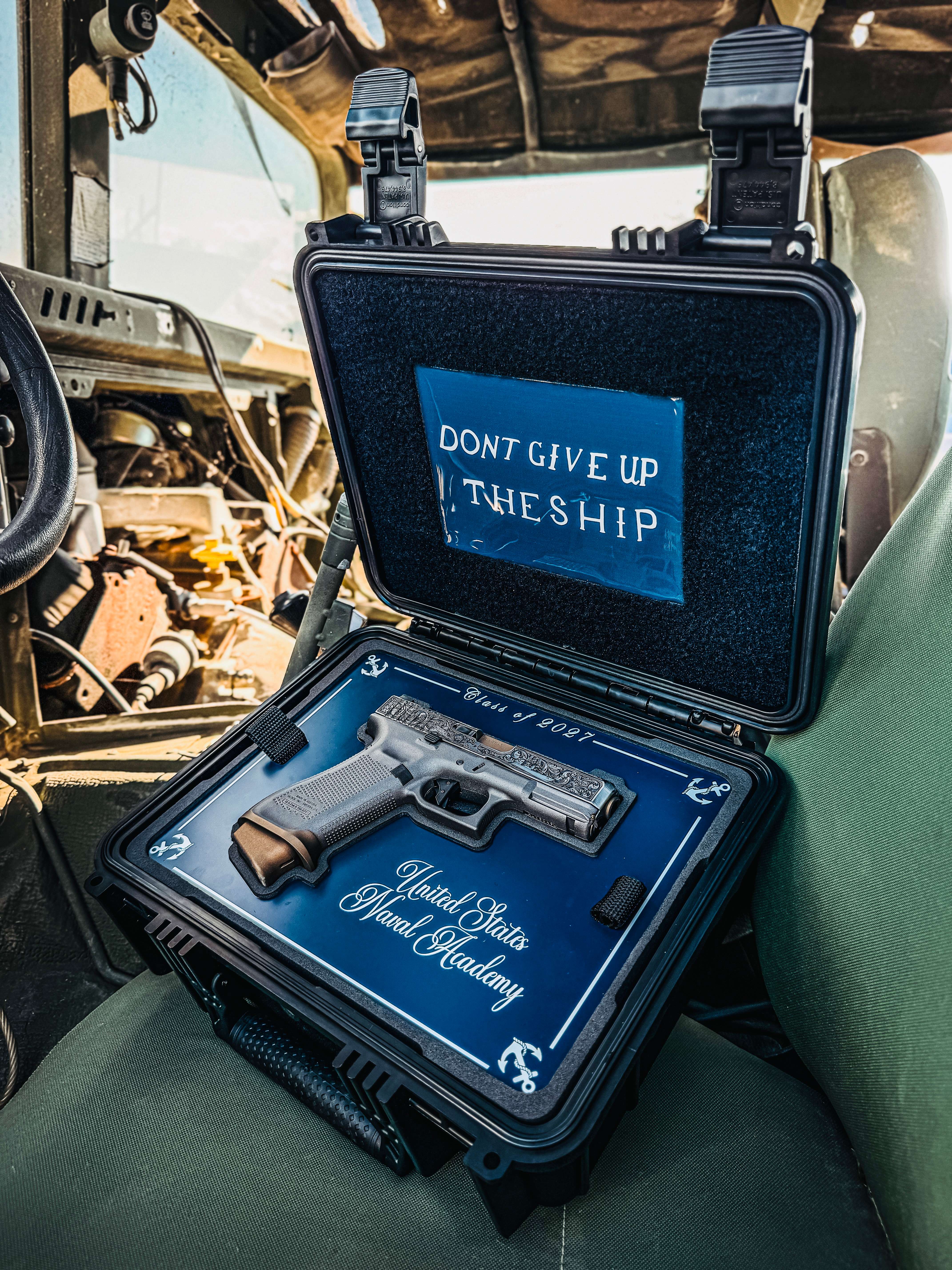 USNA Class of 2027 GLOCK 19X V — presentation case open in vehicle, “United States Naval Academy”