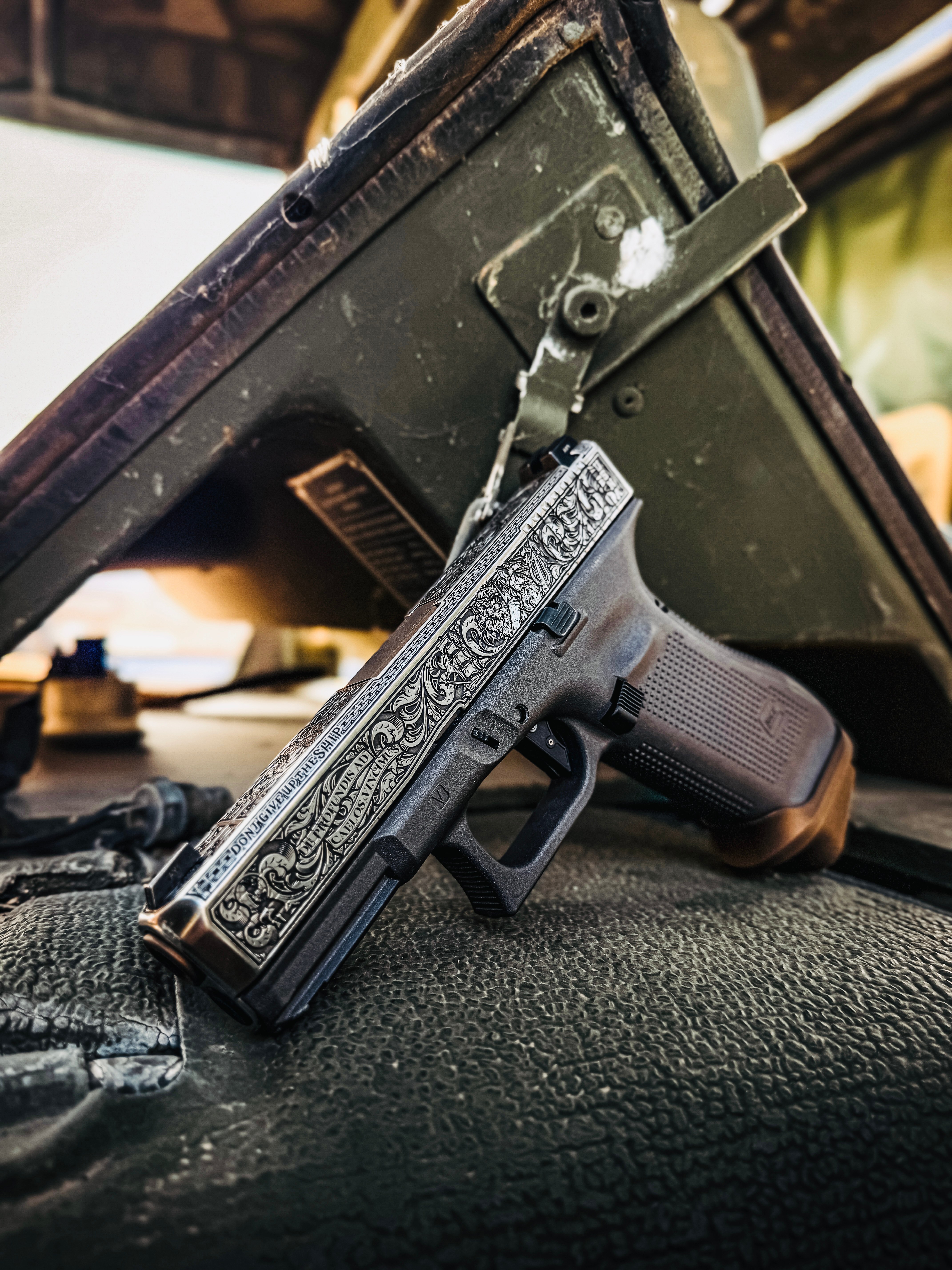 USNA Class of 2027 GLOCK 19X V — leaning against vehicle interior, “Don't Give Up the Ship” engraving