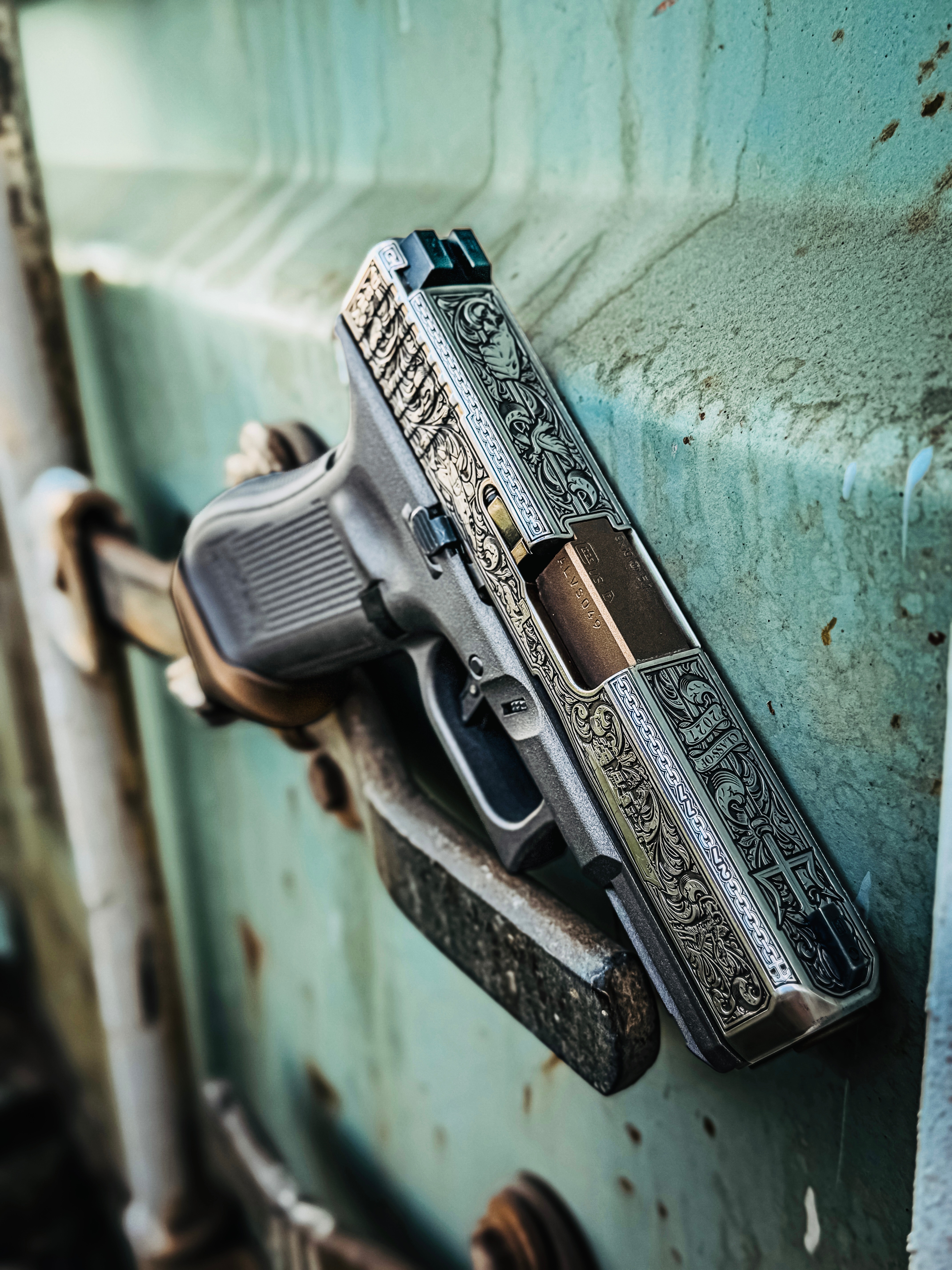 USNA Class of 2027 GLOCK 19X V — resting on vehicle wheel hub