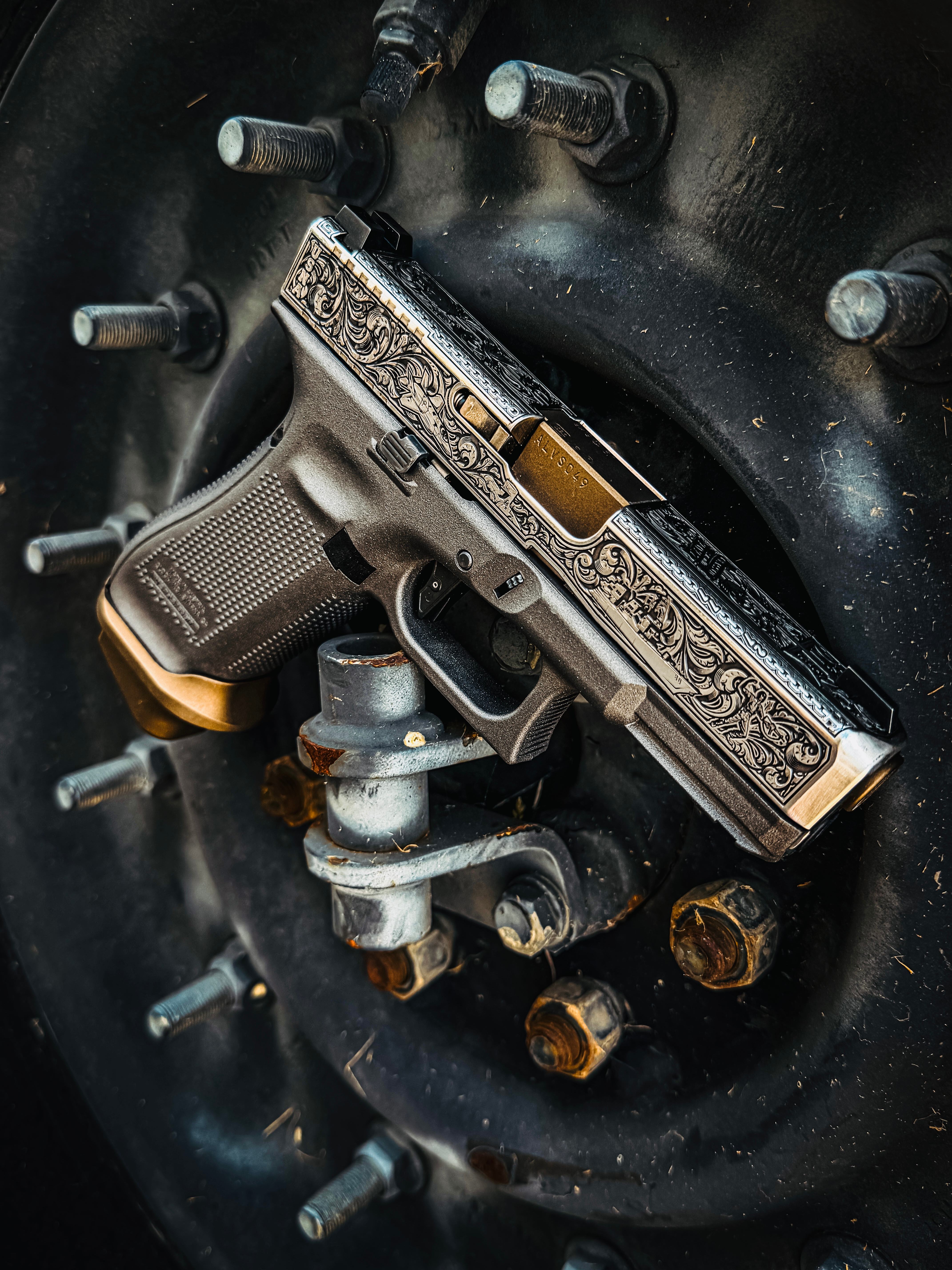 USNA Class of 2027 GLOCK 19X V — close-up slide engraving detail against weathered background